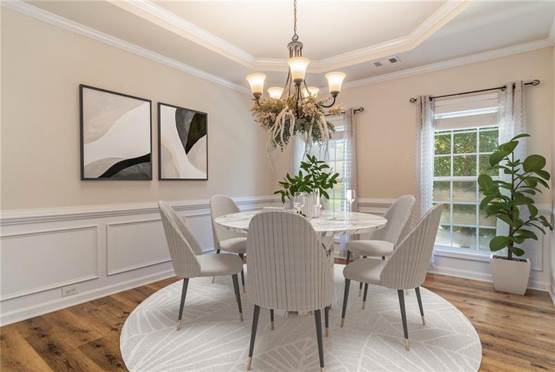 206 Sawtooth Court Canton, GA 30114 - Photo 3 of 42 a dining room with furniture potted plants and wooden floor
