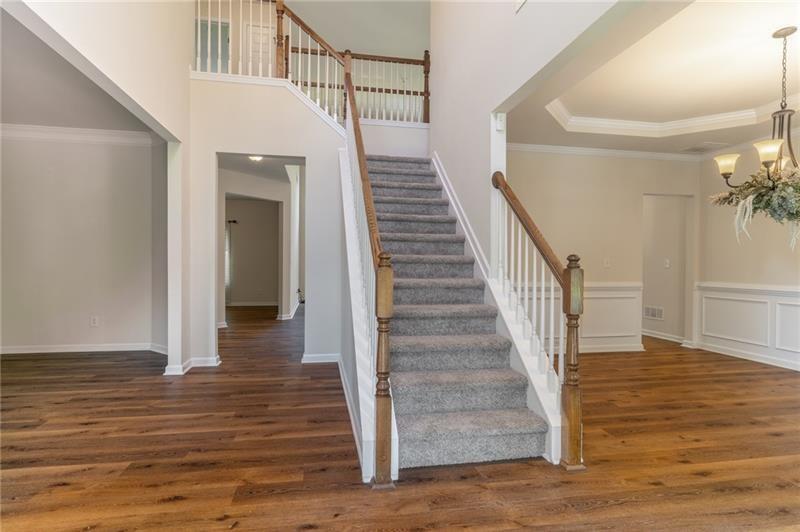 206 Sawtooth Court Canton, GA 30114 - Photo 7 of 42 a view of entryway and hall with wooden floor