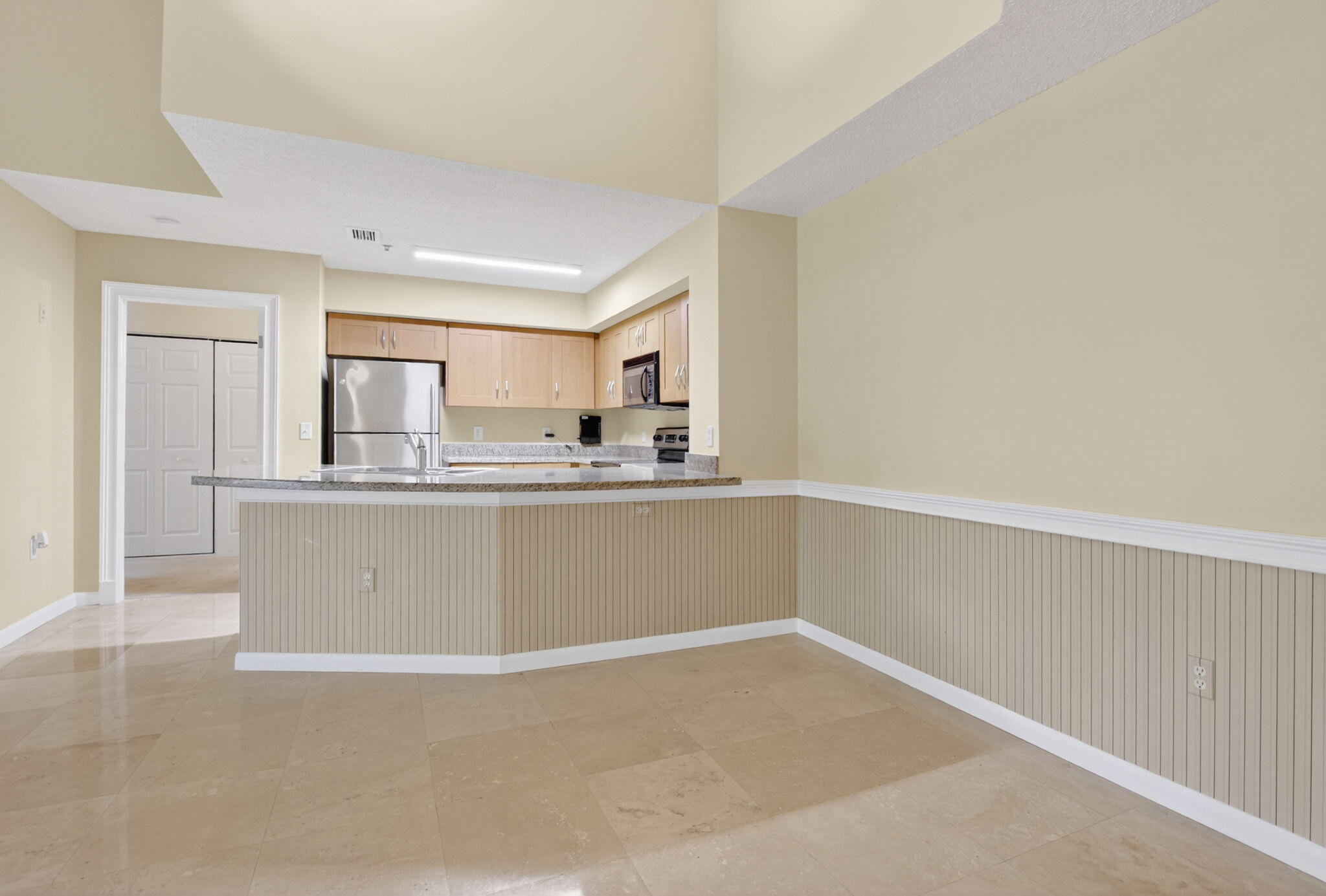 3131 Clint Moore Road, Unit 206 Boca Raton, FL 33496 - Photo 4 of 44 Dining and Kitchen Island