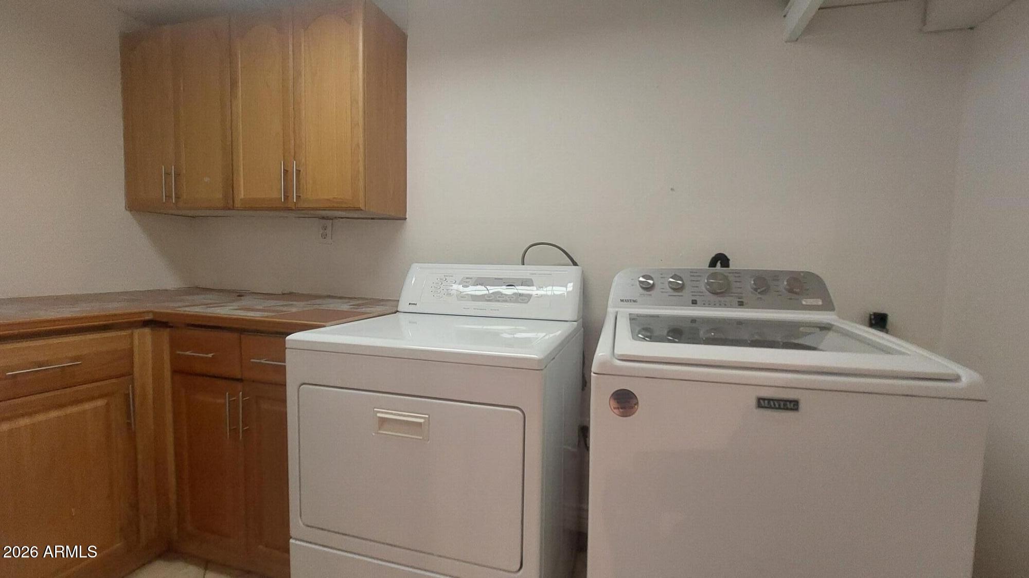 2448 West Freeway Lane Phoenix, AZ 85021 - Photo 26 of 27 a utility room with dryer and washer