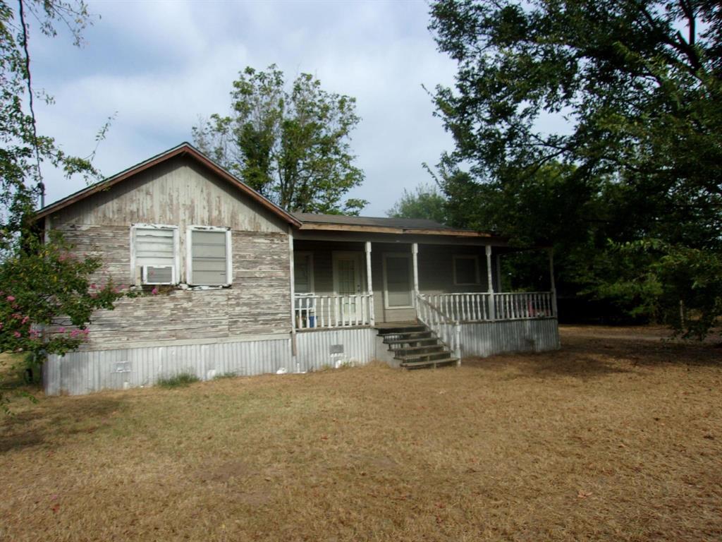 2846 County Road 2415 Como, TX 75431 - Photo 12 of 17 a front view of a house with garden
