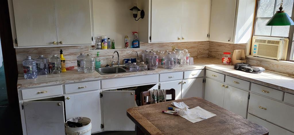2846 County Road 2415 Como, TX 75431 - Photo 13 of 17 a kitchen with stainless steel appliances granite countertop a sink a stove and cabinets