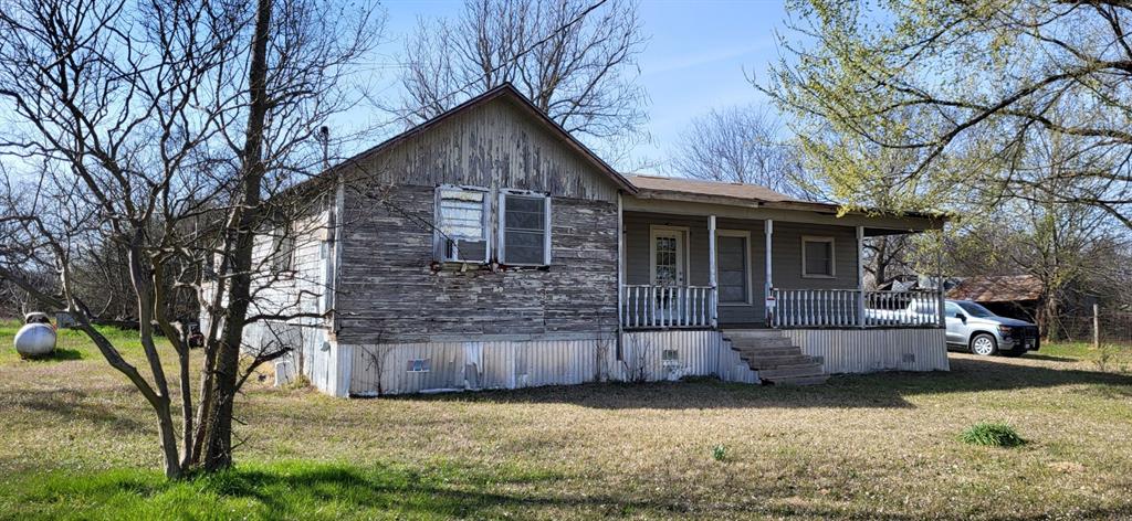 2846 County Road 2415 Pickton, TX 75471 - Photo 14 of 23 a view of a house with a yard