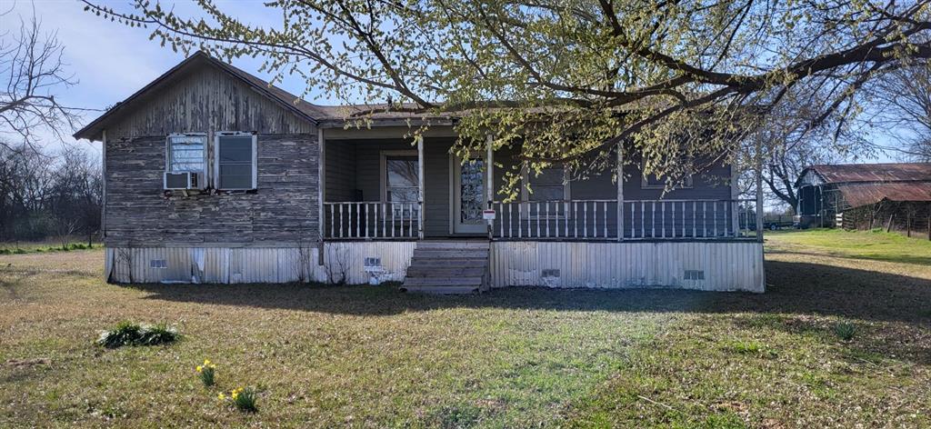 2846 County Road 2415 Como, TX 75431 - Photo 17 of 17 a view of a backyard with a garden