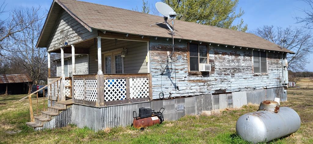 2846 County Road 2415 Como, TX 75431 - Photo 10 of 17 a view of a house with backyard and sitting area