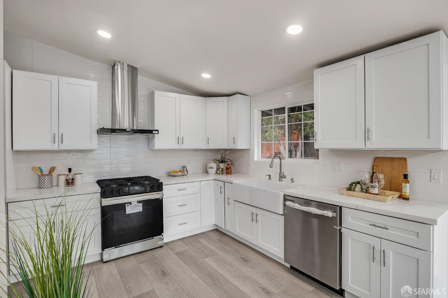 2625 Kavanagh Road San Pablo, CA 94806 - Photo 15 of 45 a kitchen with a sink a stove and cabinets