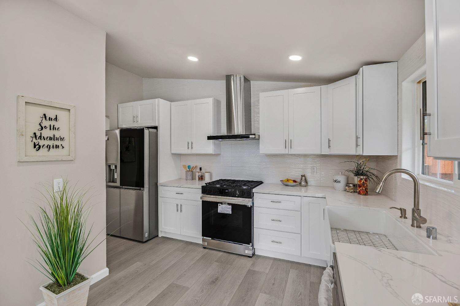 2625 Kavanagh Road San Pablo, CA 94806 - Photo 16 of 45 a kitchen with white cabinets and stainless steel appliances