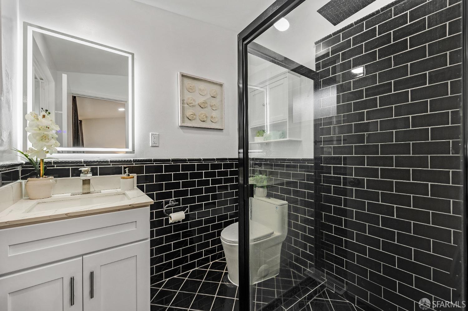 2625 Kavanagh Road San Pablo, CA 94806 - Photo 26 of 45 a bathroom with a sink toilet shower and a mirror