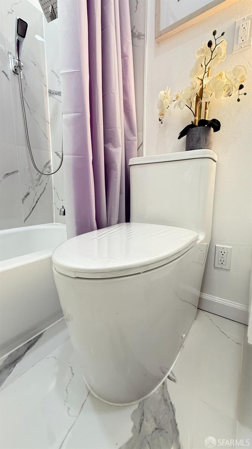 2625 Kavanagh Road San Pablo, CA 94806 - Photo 35 of 45 a white toilet sitting next to a bath tub and a shower