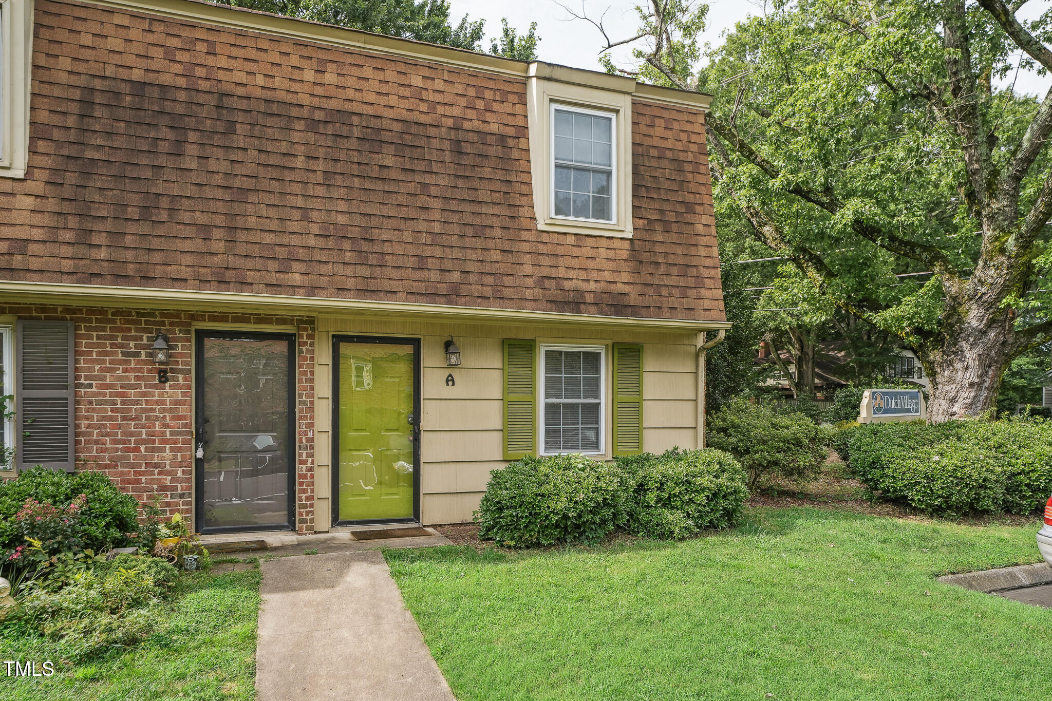 149 Jones Franklin Road, Unit A Raleigh, NC 27606 - Photo 3 of 21 a front view of a house with garden