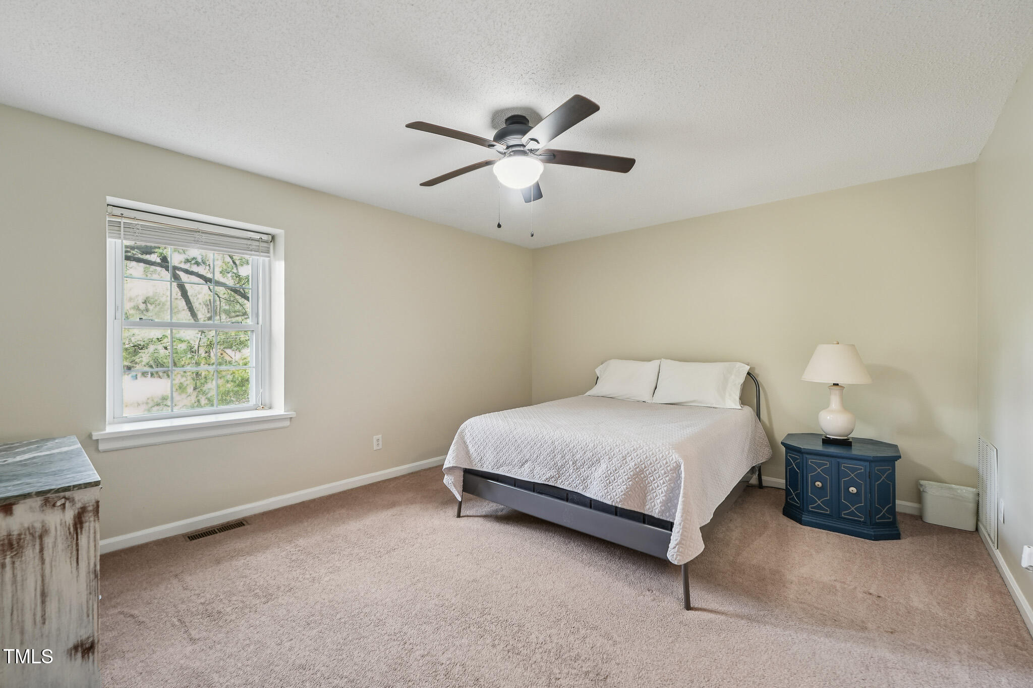 149 Jones Franklin Road, Unit A Raleigh, NC 27606 - Photo 10 of 21 a bedroom with a bed and window