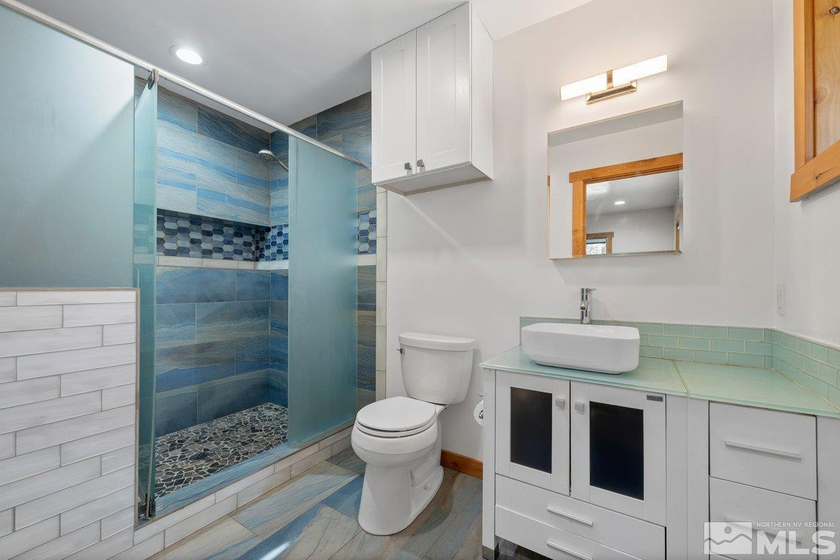 190 Meadow Drive Stateline, NV 89449 - Photo 11 of 26 a bathroom with a sink toilet and shower