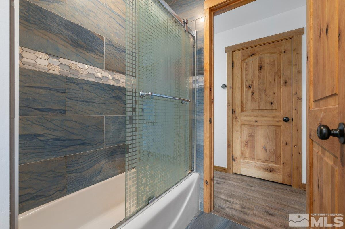 190 Meadow Drive Stateline, NV 89449 - Photo 17 of 26 a bathroom with a glass shower door