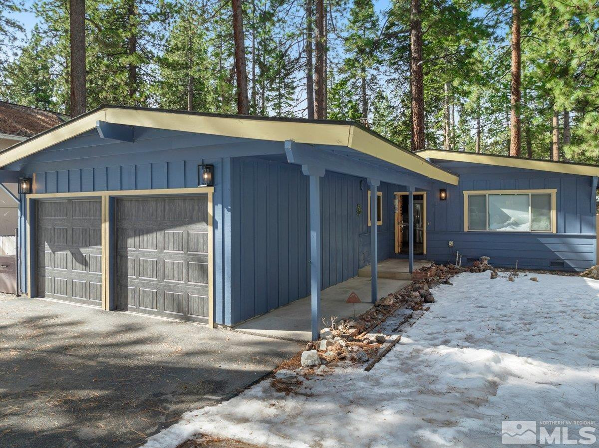 190 Meadow Drive Stateline, NV 89449 - Photo 2 of 26 a view of a house with a yard and large tree