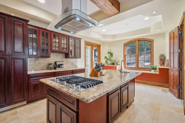 a kitchen that has a lot of cabinets in it