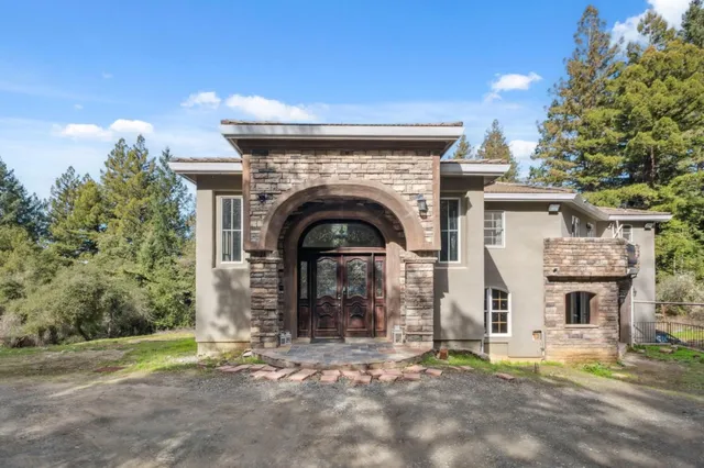 a front view of a house with yard