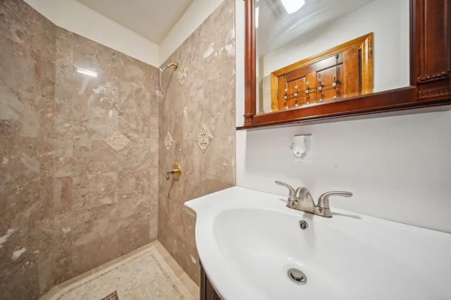 a bathroom with a sink and a mirror