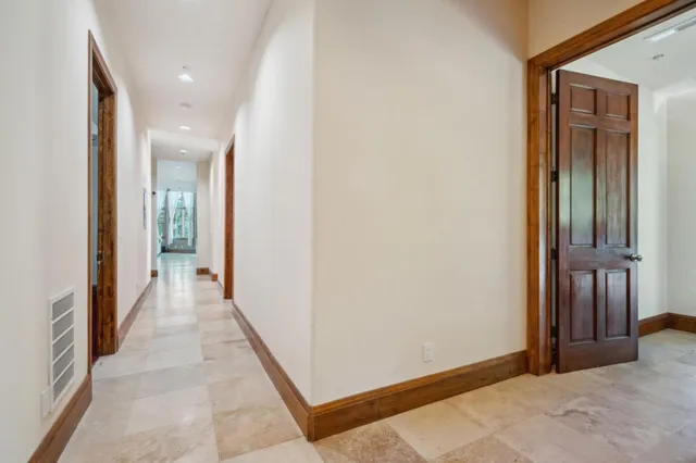 a view of a hallway with a room