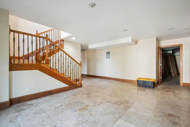a view of an empty room with stairs