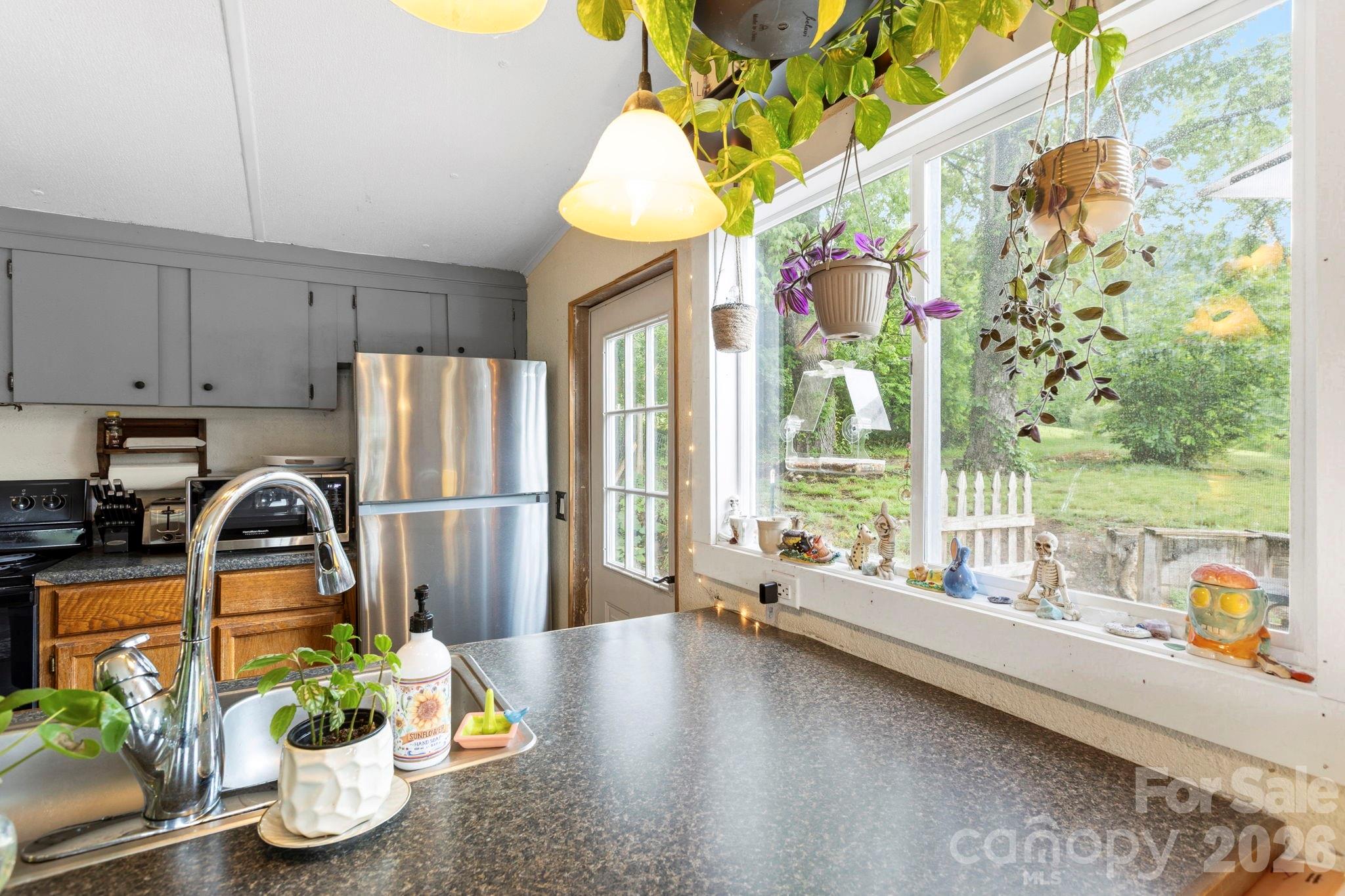 4 Mountain View Road Asheville, NC 28806 - Photo 20 of 35 a kitchen with sink refrigerator and window