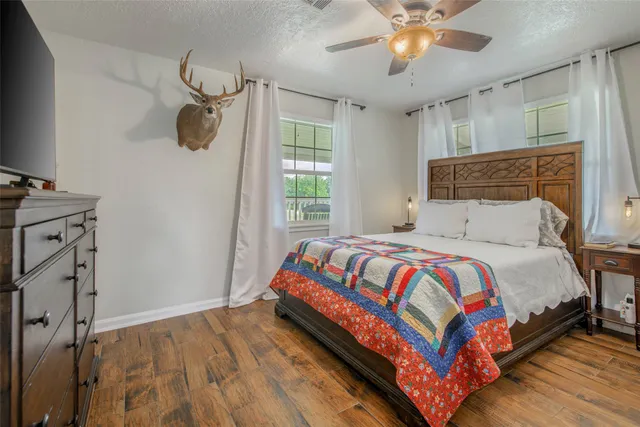 a bedroom with a bed and window