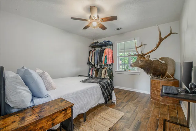 a bedroom with furniture and a chandelier