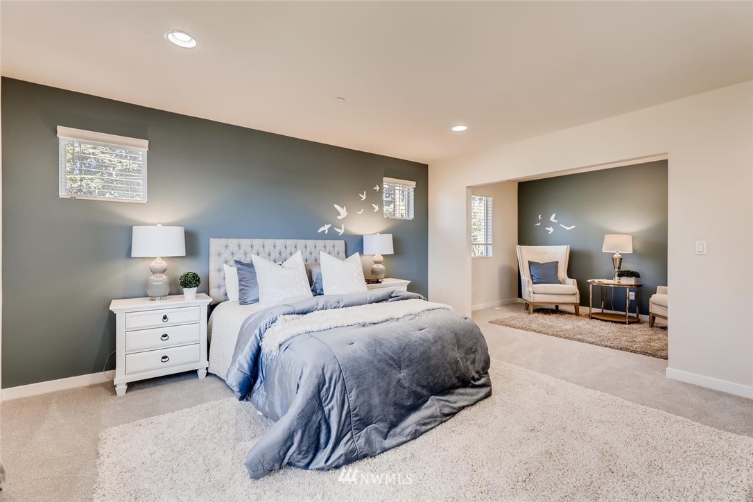 4427 232nd Place Southeast, Unit 20 Bothell, WA 98021 - Photo 15 of 28 a spacious bedroom with a bed couch and a view of bathroom