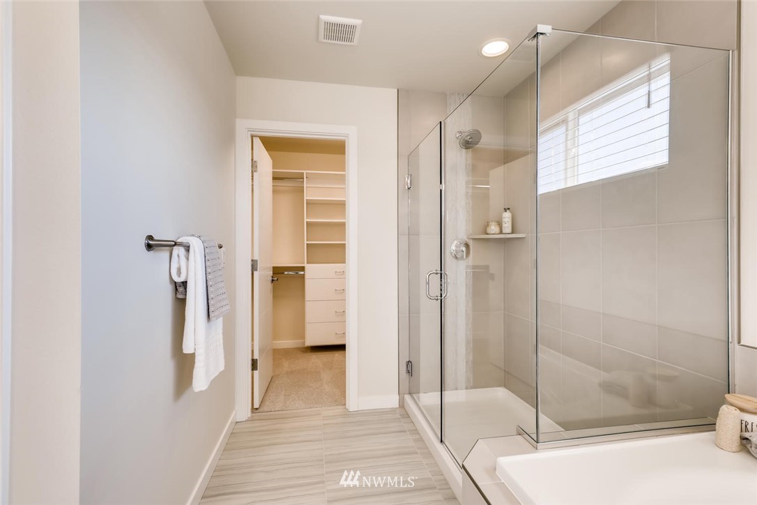 4427 232nd Place Southeast, Unit 20 Bothell, WA 98021 - Photo 18 of 28 a bathroom with a shower and a tub
