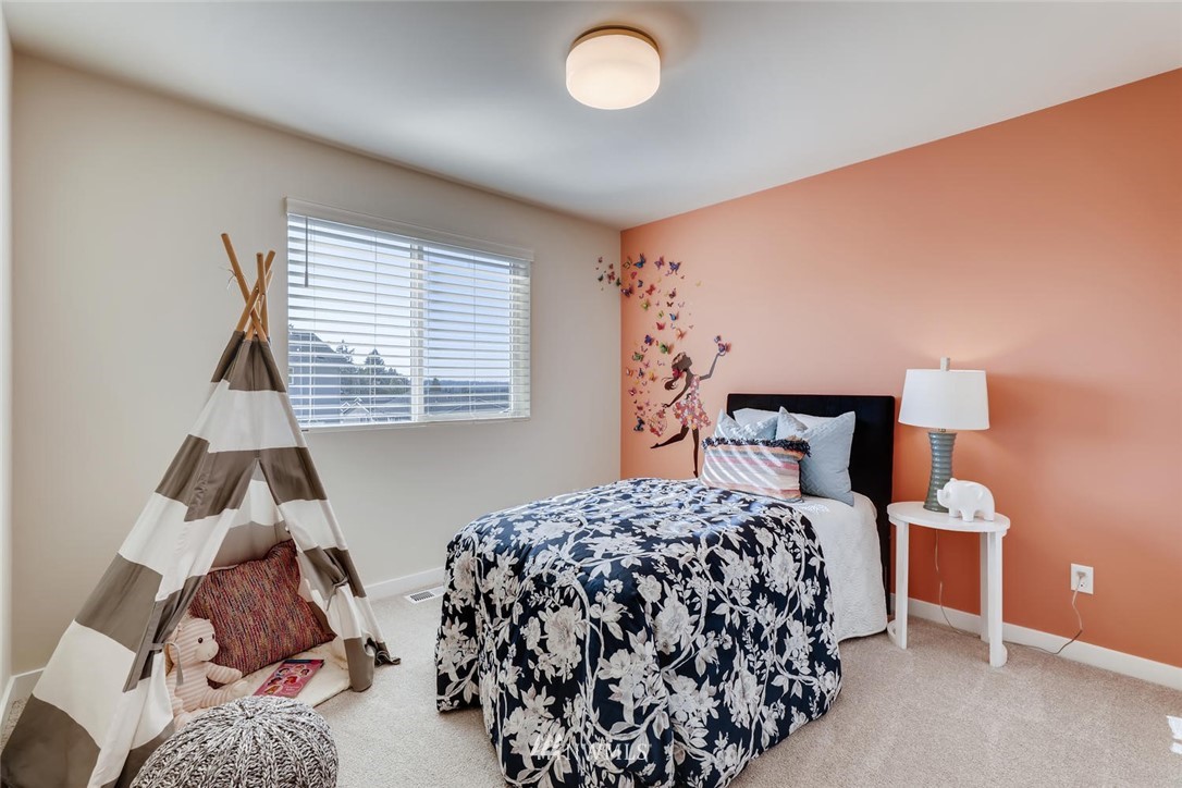 4427 232nd Place Southeast, Unit 20 Bothell, WA 98021 - Photo 20 of 28 a bedroom with a bed and a window