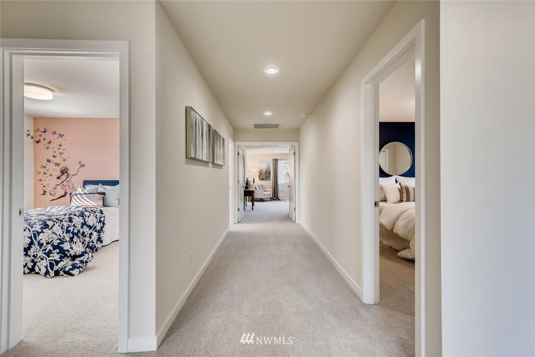 4427 232nd Place Southeast, Unit 20 Bothell, WA 98021 - Photo 24 of 28 a view of hallway with livingroom and a chandelier