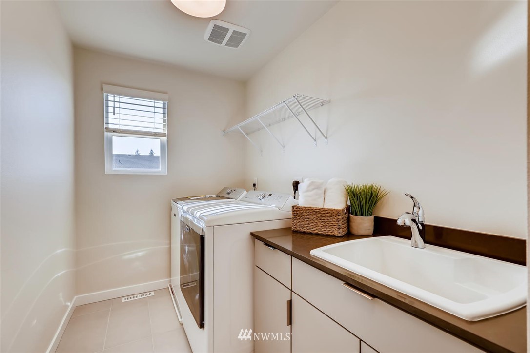 4427 232nd Place Southeast, Unit 20 Bothell, WA 98021 - Photo 25 of 28 a utility room with dryer and washer