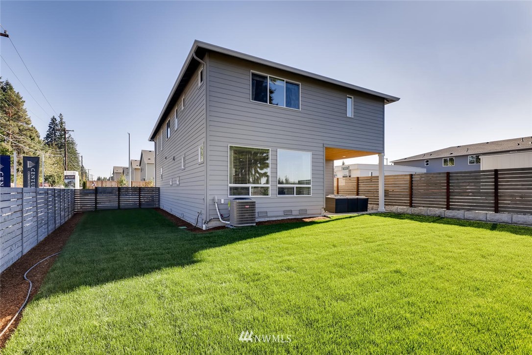 4427 232nd Place Southeast, Unit 20 Bothell, WA 98021 - Photo 28 of 28 a view of a house with a yard and sitting area