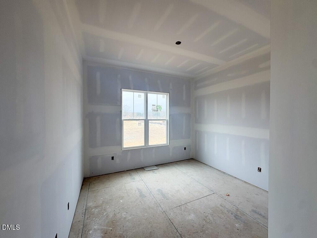 5848 Carriage Drive Raleigh, NC 27603 - Photo 9 of 26 an empty room with a window