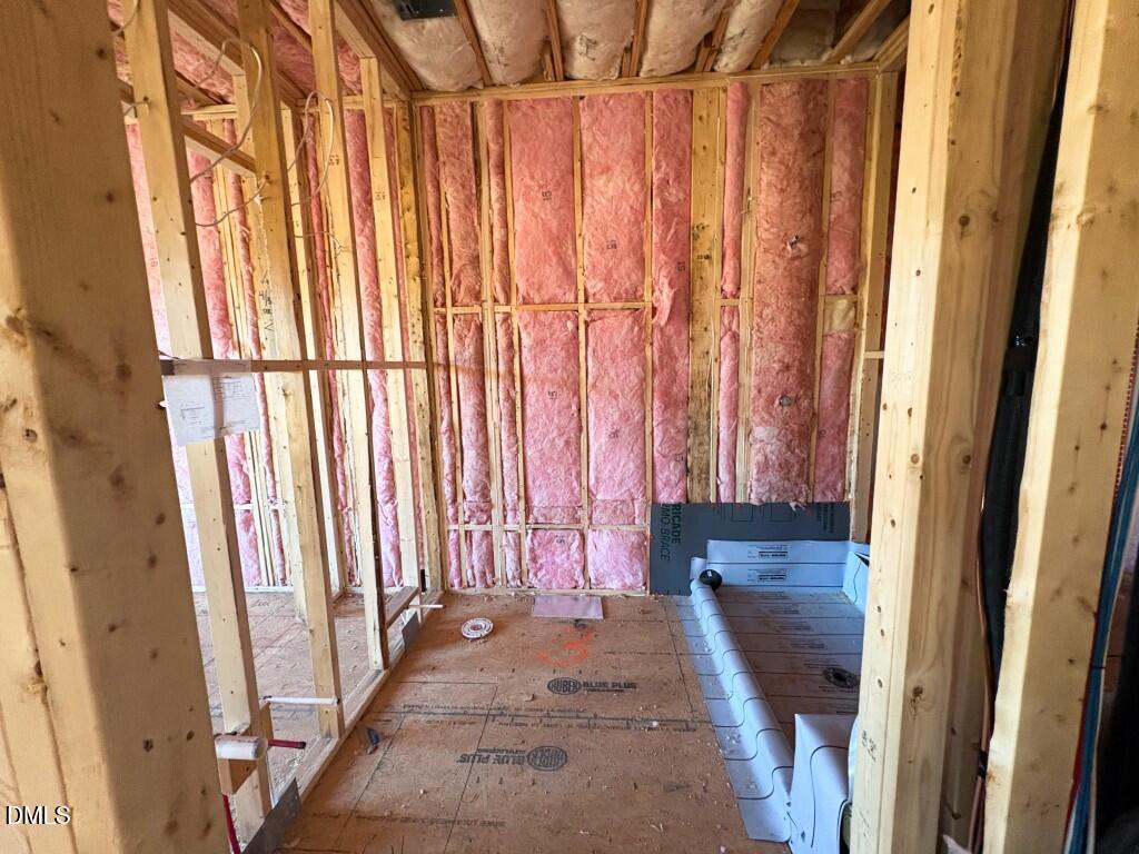 5848 Carriage Drive Raleigh, NC 27603 - Photo 12 of 24 a view of walk in closet with rug and a window