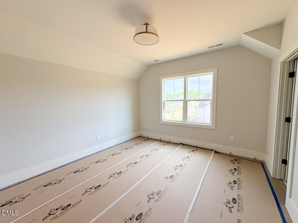 5848 Carriage Drive Raleigh, NC 27603 - Photo 11 of 28 a view of an empty room and window