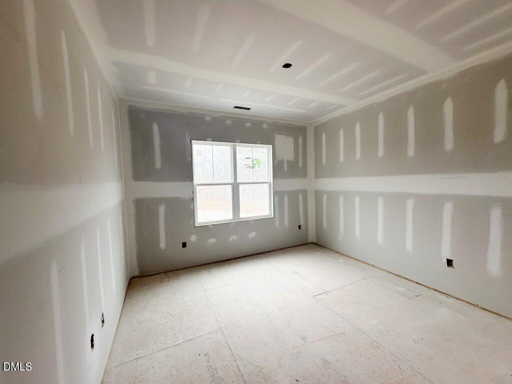 5848 Carriage Drive Raleigh, NC 27603 - Photo 12 of 26 an empty room with windows