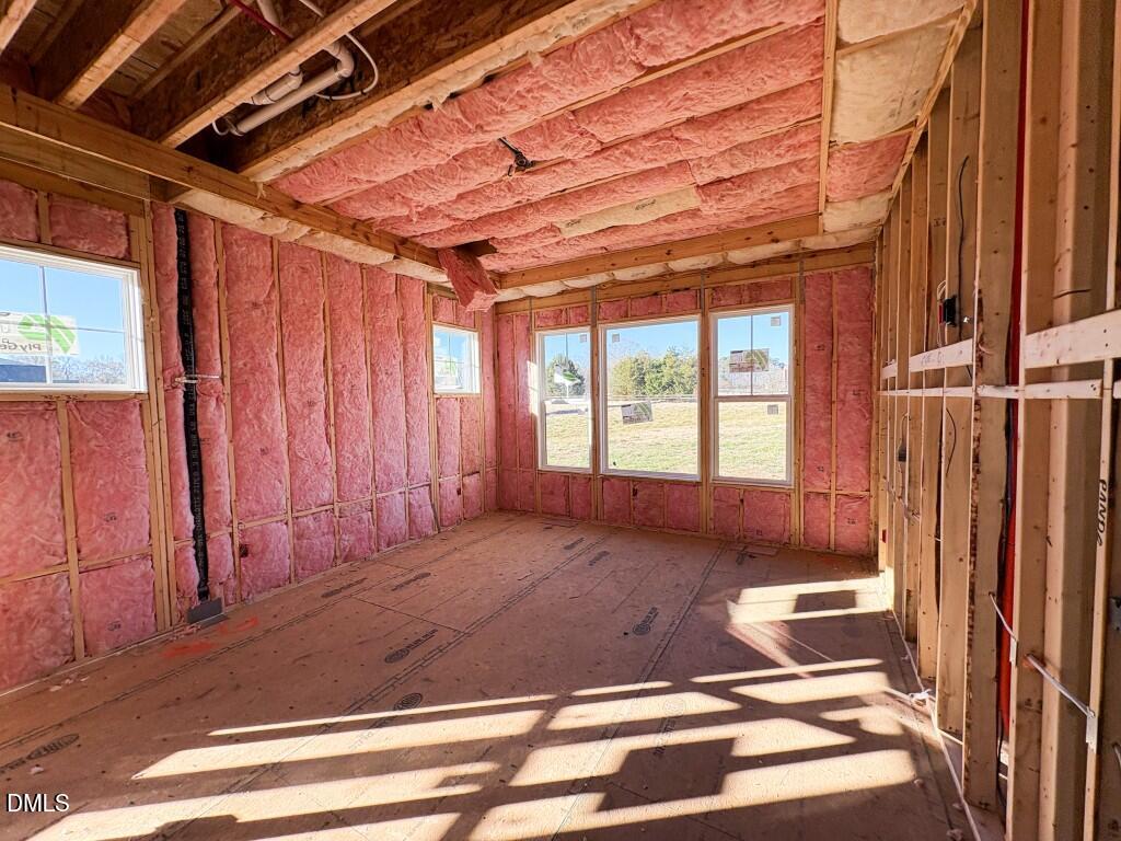 5848 Carriage Drive Raleigh, NC 27603 - Photo 15 of 24 a view of a room with a bed and wooden floor
