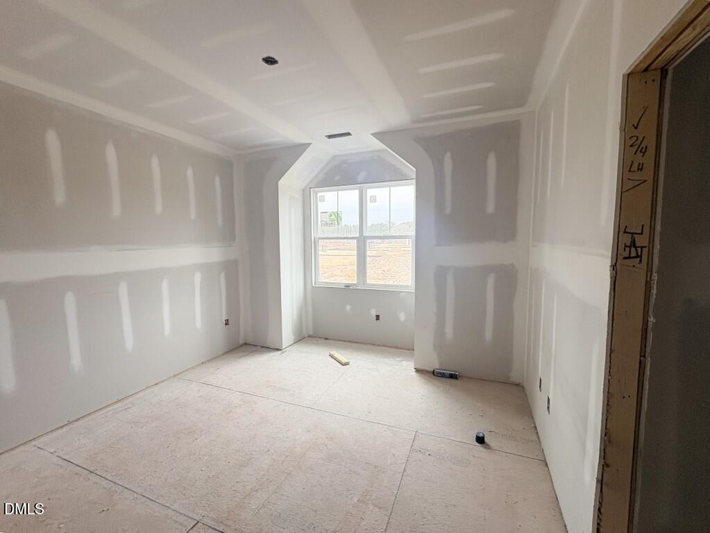 5848 Carriage Drive Raleigh, NC 27603 - Photo 14 of 26 a view of an empty room with a window