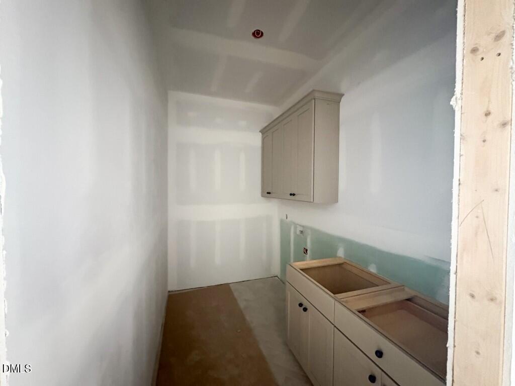 5848 Carriage Drive Raleigh, NC 27603 - Photo 16 of 26 a bathroom with a sink and a mirror