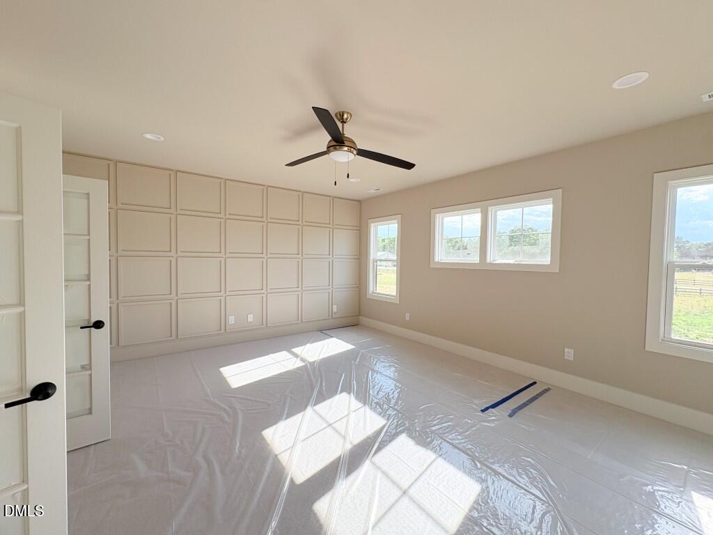 5848 Carriage Drive Raleigh, NC 27603 - Photo 17 of 28 a view of a livingroom with a ceiling fan and window