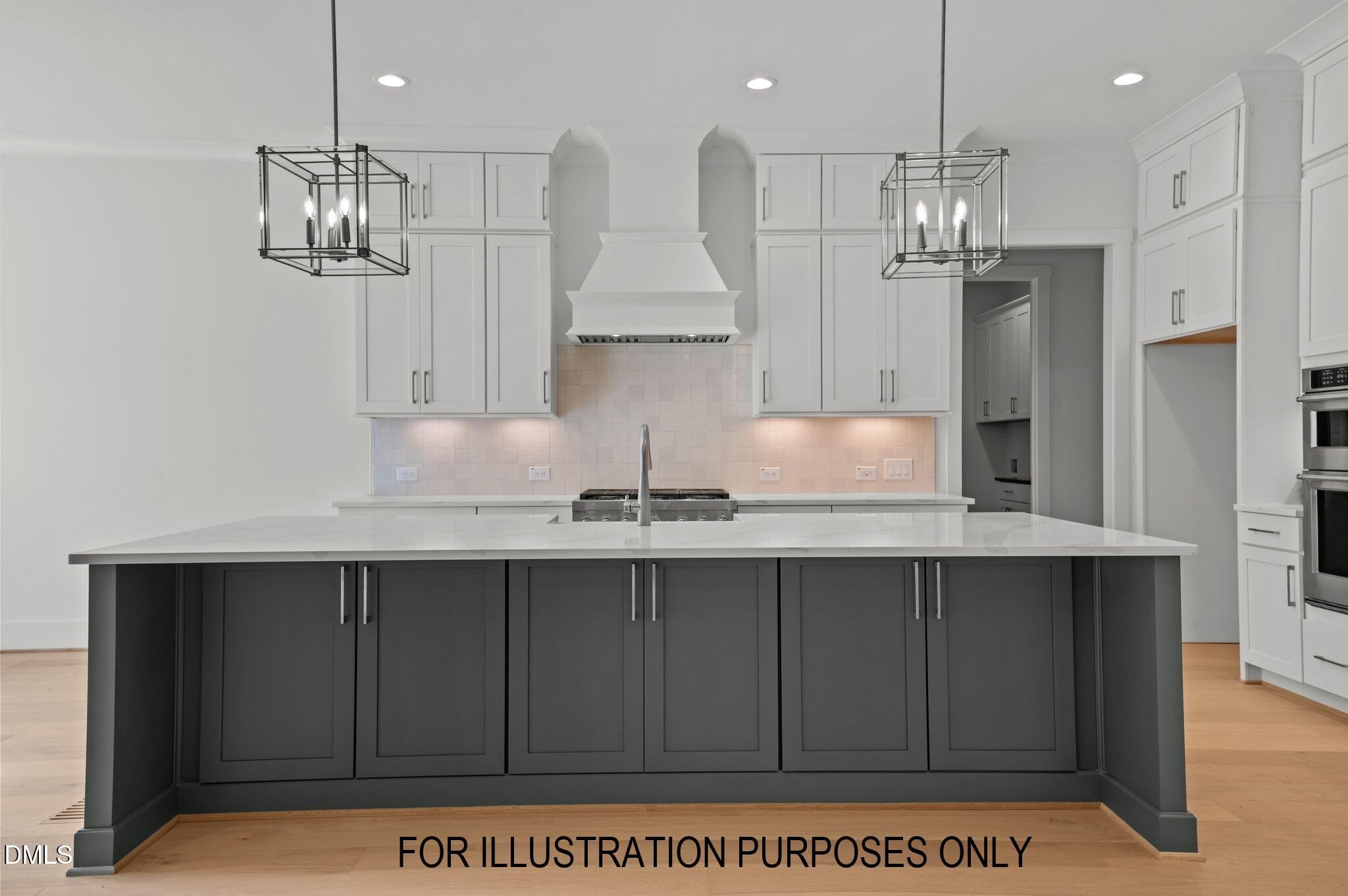 5848 Carriage Drive Raleigh, NC 27603 - Photo 18 of 26 a kitchen with kitchen island stainless steel appliances a sink stove and refrigerator