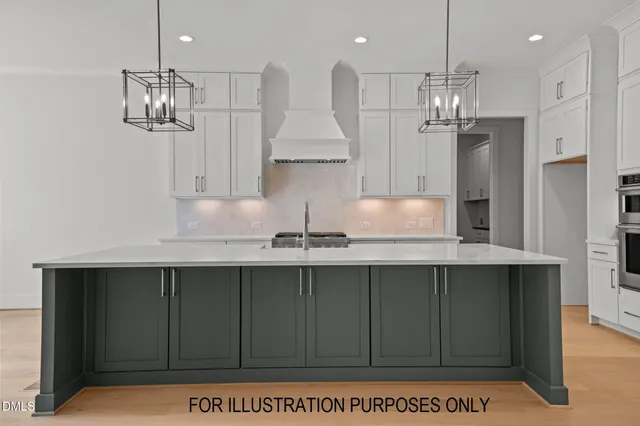 a kitchen with kitchen island stainless steel appliances a sink stove and refrigerator