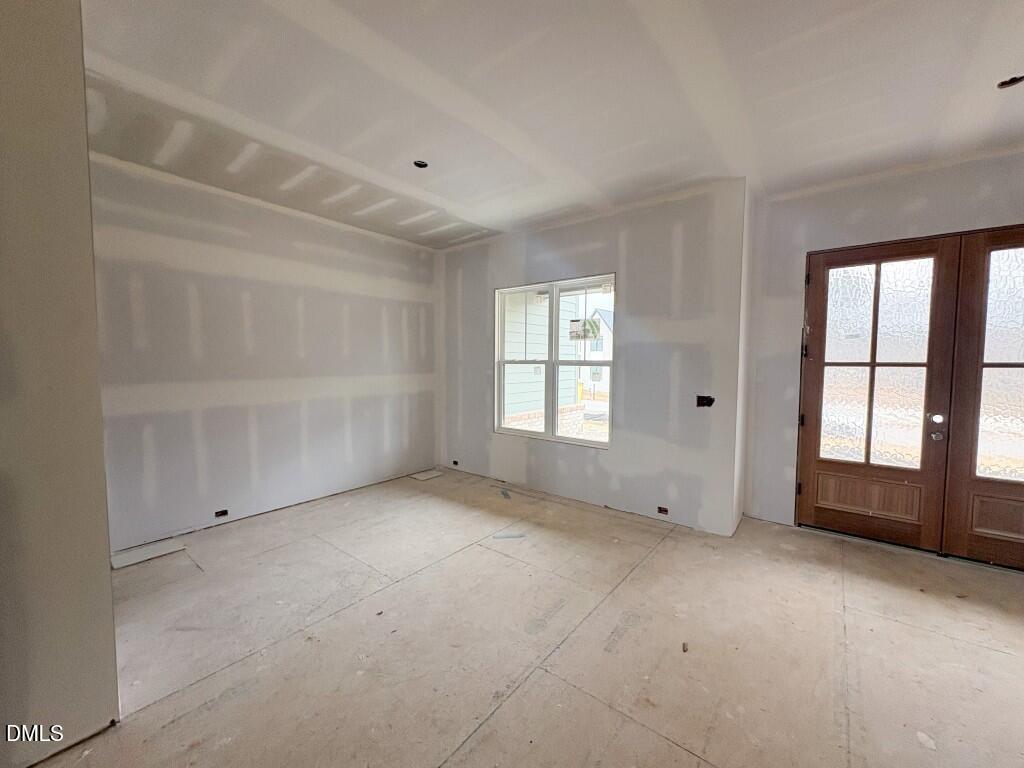 5848 Carriage Drive Raleigh, NC 27603 - Photo 3 of 26 an empty room with windows