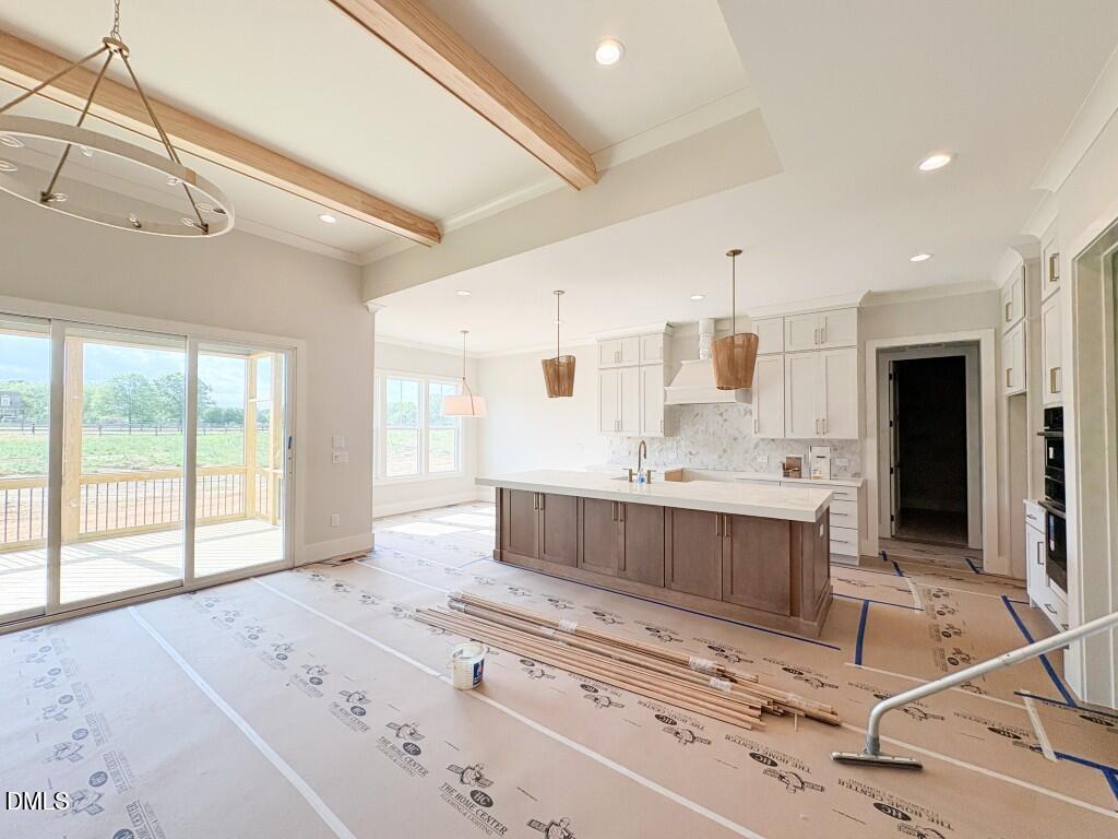 5848 Carriage Drive Raleigh, NC 27603 - Photo 4 of 28 a large bathroom with a large tub and sink