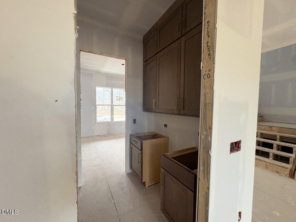 5848 Carriage Drive Raleigh, NC 27603 - Photo 4 of 26 a kitchen with a refrigerator and a sink