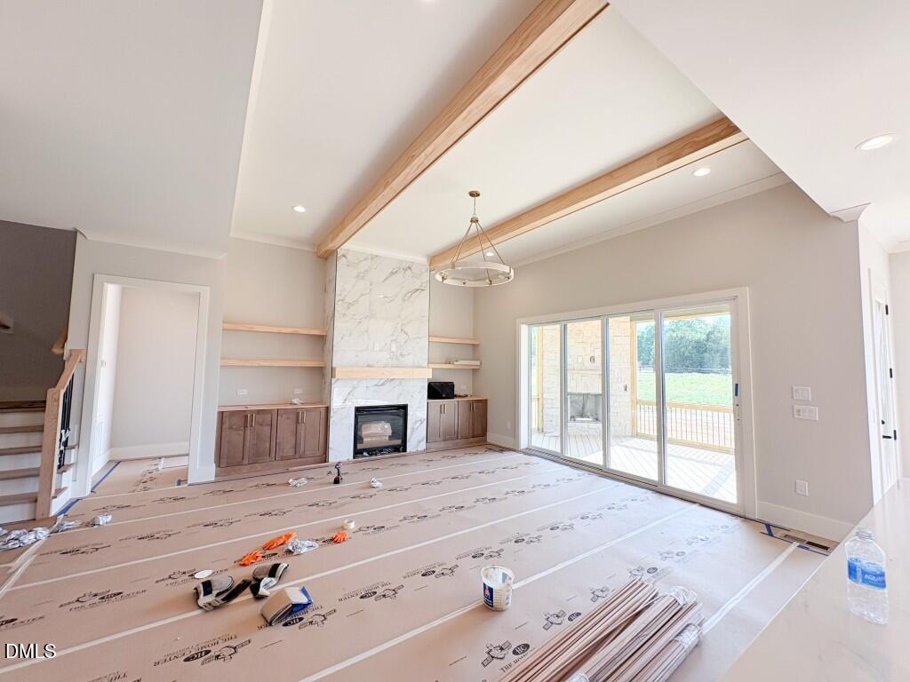 5848 Carriage Drive Raleigh, NC 27603 - Photo 5 of 28 a spacious bedroom with a large bed and a flat screen tv