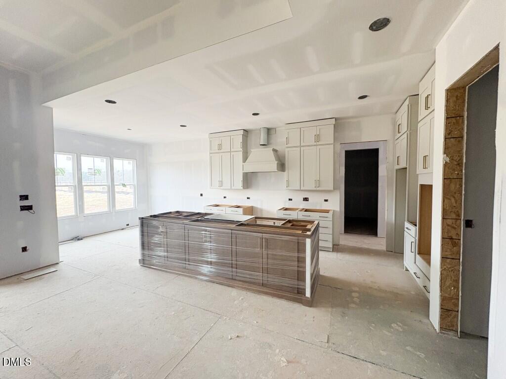 5848 Carriage Drive Raleigh, NC 27603 - Photo 5 of 26 a large bathroom with a large tub shower and sink