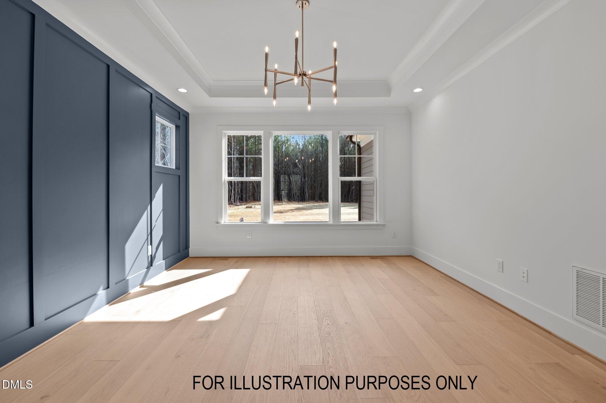 5848 Carriage Drive Raleigh, NC 27603 - Photo 7 of 24 a view of an empty room with a window