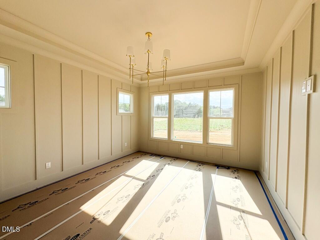 5848 Carriage Drive Raleigh, NC 27603 - Photo 6 of 28 a view of an empty room with a window