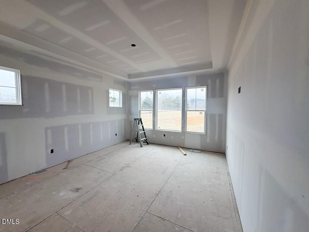 5848 Carriage Drive Raleigh, NC 27603 - Photo 7 of 26 a view of an empty room with a window